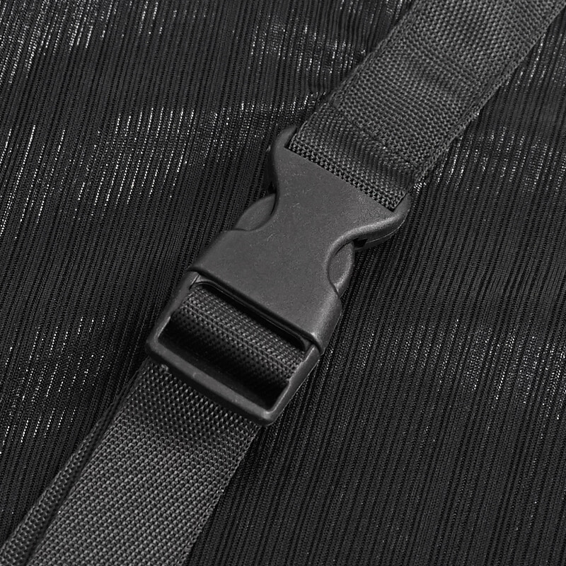 Close-up of a black buckle strap, showcasing textured fabric and secure fastening for stylish punk attire.