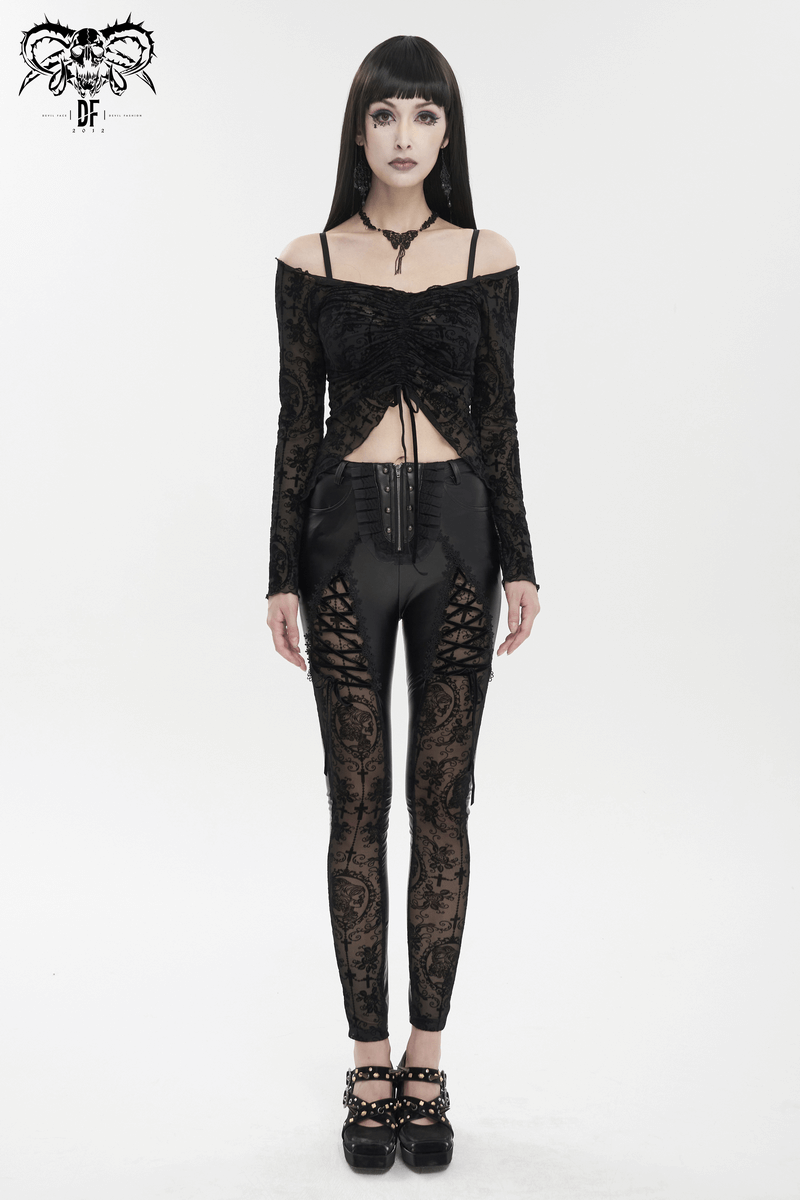 Gothic fashion model in black lace-up leggings and cropped lace top, showcasing punk style. Perfect for alternative wardrobes.