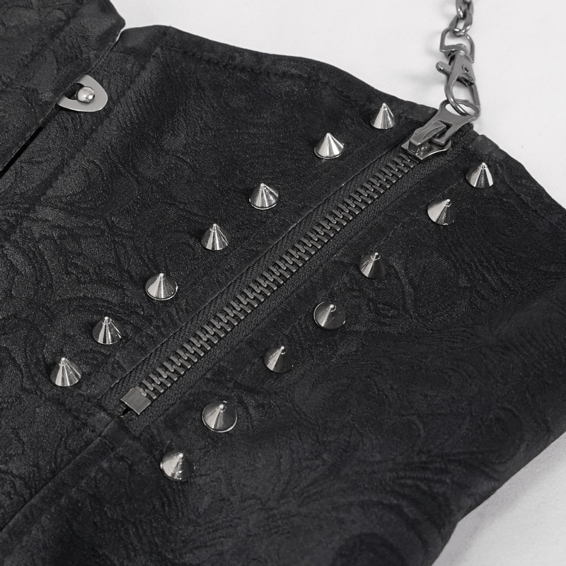 Close-up of a black punk corset featuring a zipper, metal spikes, and chains for a trendy edgy look.