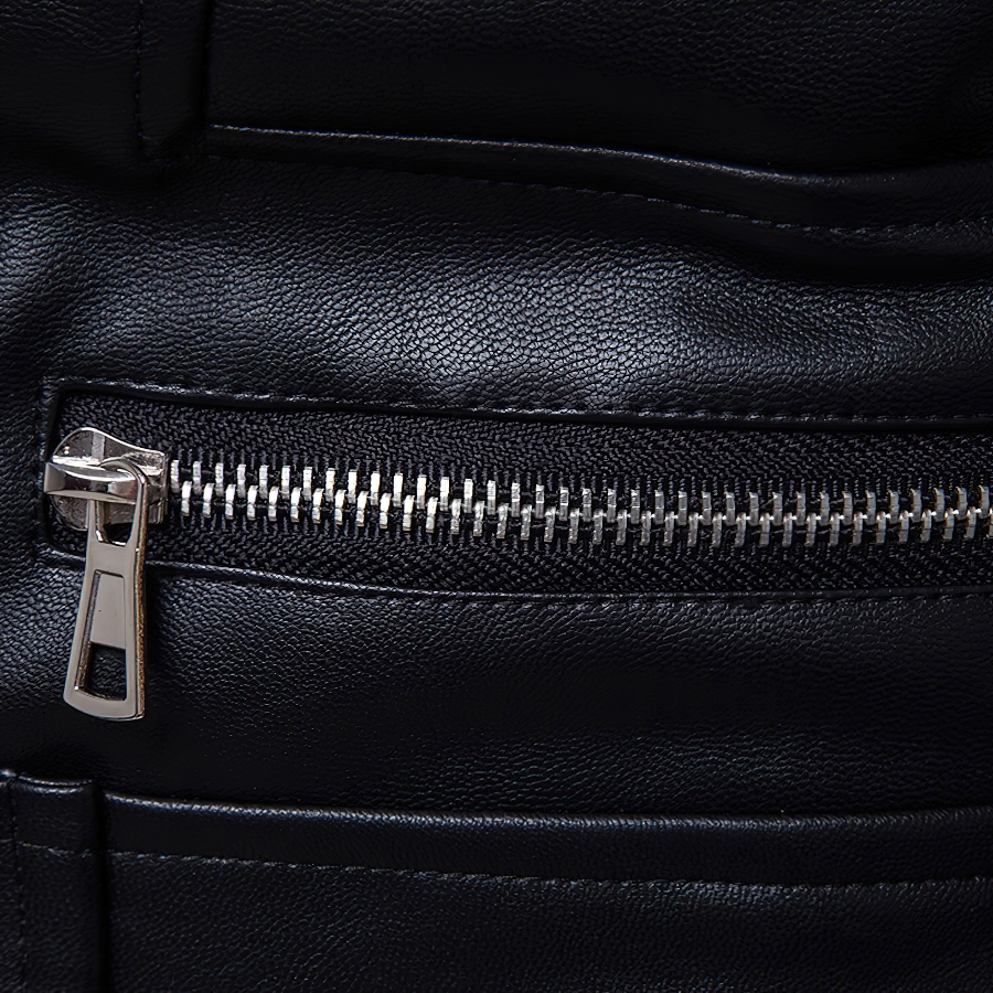 Close-up of black PU leather men's jacket zipper, showcasing punk rock style and quality craftsmanship.