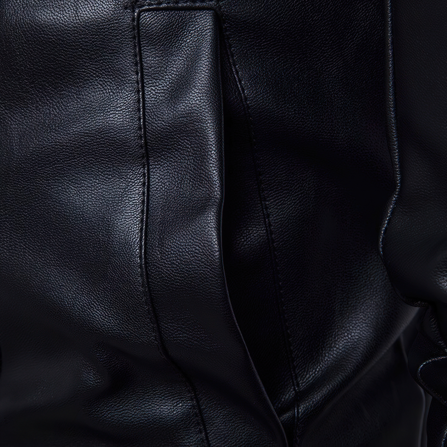 Close-up of black PU leather texture showcasing soft, durable material of a punk rock men's jacket.