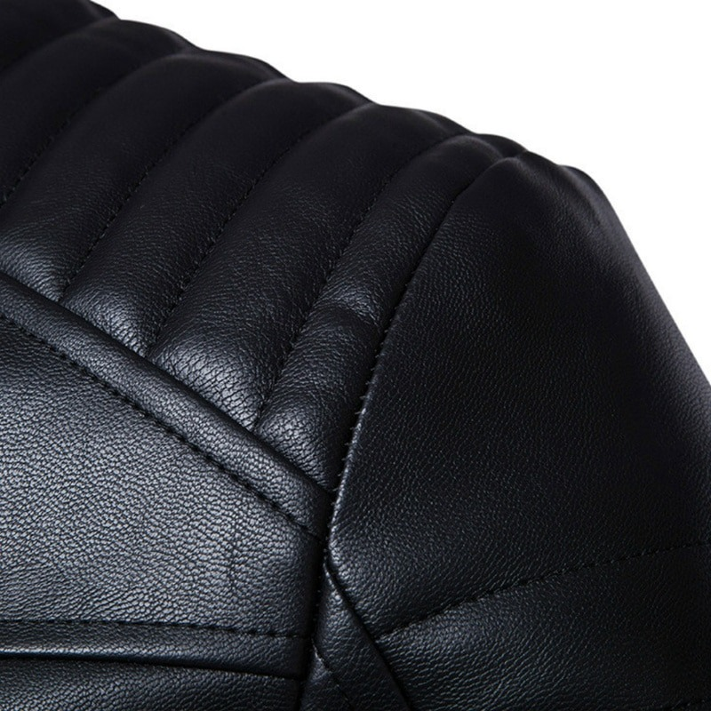 Close-up of black PU leather texture on a punk style men's jacket, featuring stylish quilted stitching.