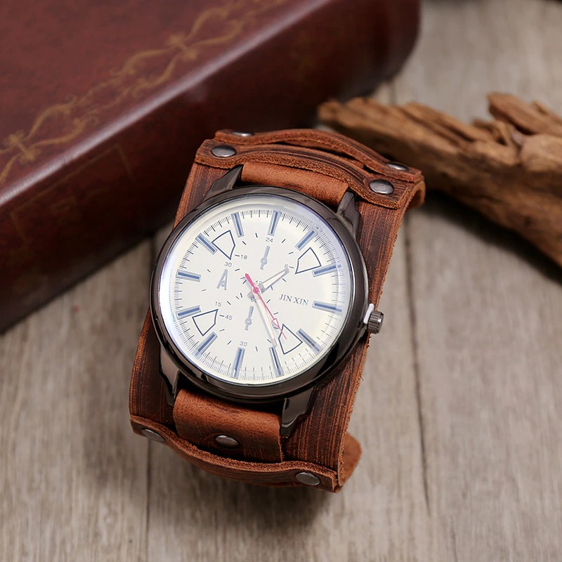 Quartz men's watch with genuine leather strap on wooden surface, showcasing casual style and modern design.