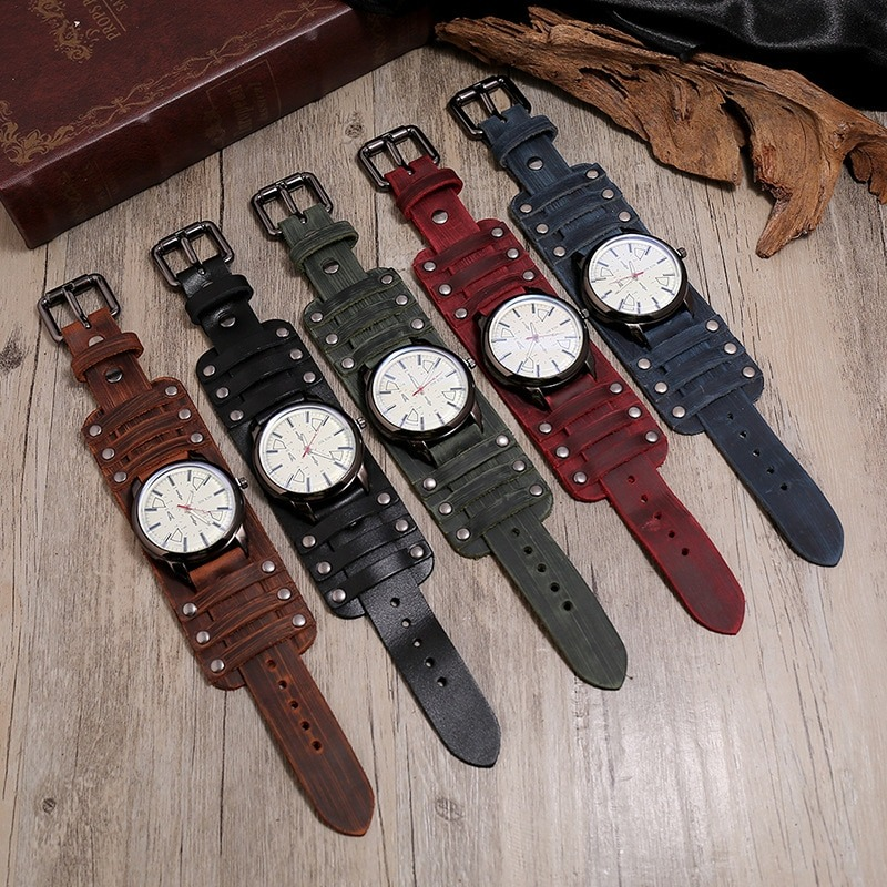 Quartz men's watches with genuine leather straps in five stylish colors displayed on a wooden surface.