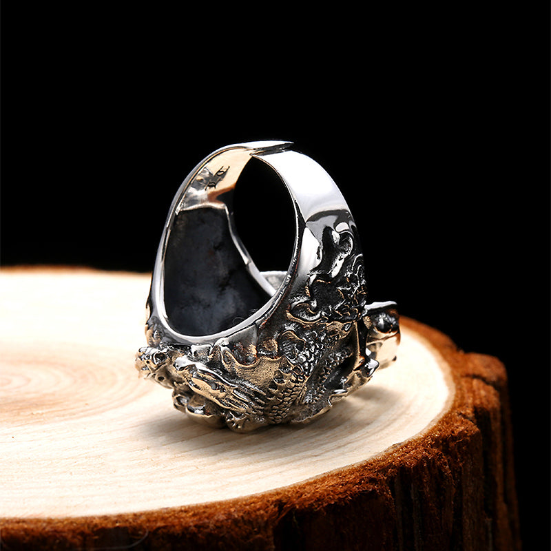 Real 925 Sterling Silver Skull Ring on wooden surface, showcasing detailed biker jewelry design and adjustable fit.