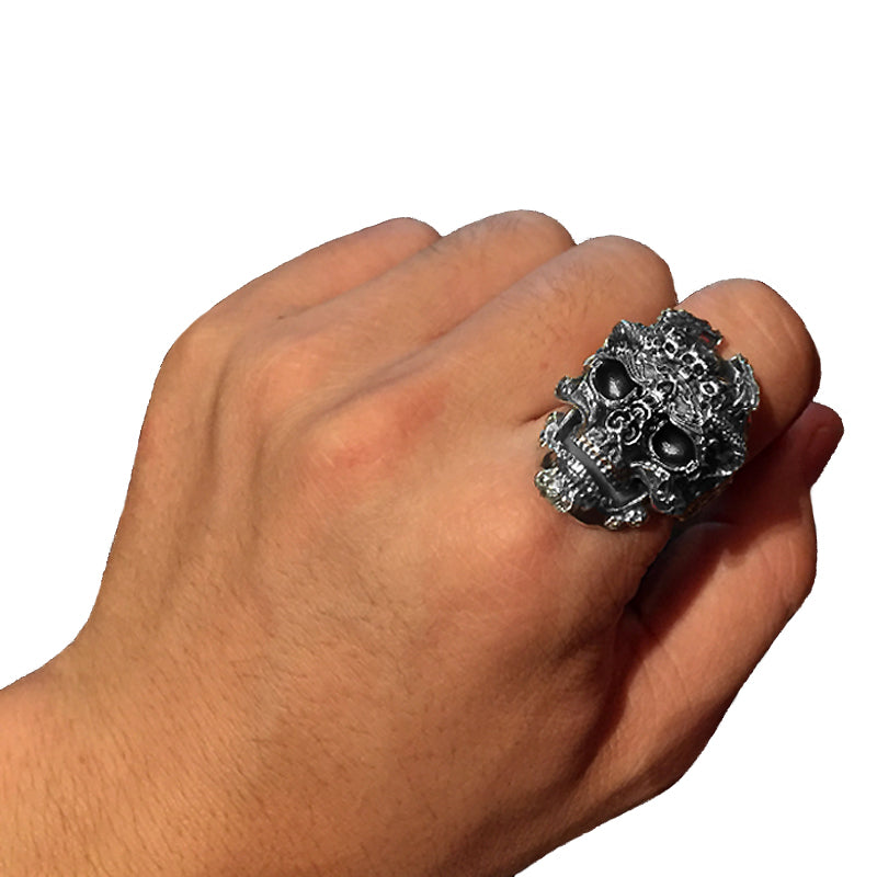 Hand wearing a bold 925 sterling silver skull ring, showcasing biker jewelry style and adjustable fit.
