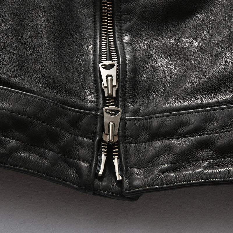 Close-up of a black leather jacket zipper showcasing quality craftsmanship and retro design.