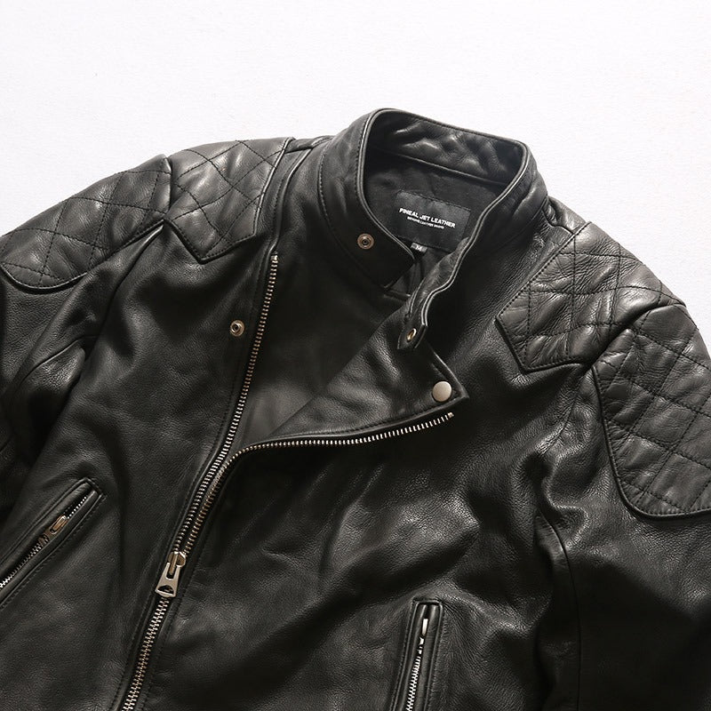 Men's black retro leather jacket with quilted shoulders and zippers, perfect for biking and casual outings.