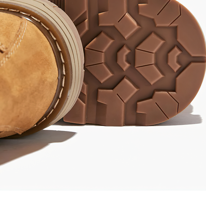 Close-up of the outsole of vintage leather combat boots, showcasing the rugged tread and quality craftsmanship.