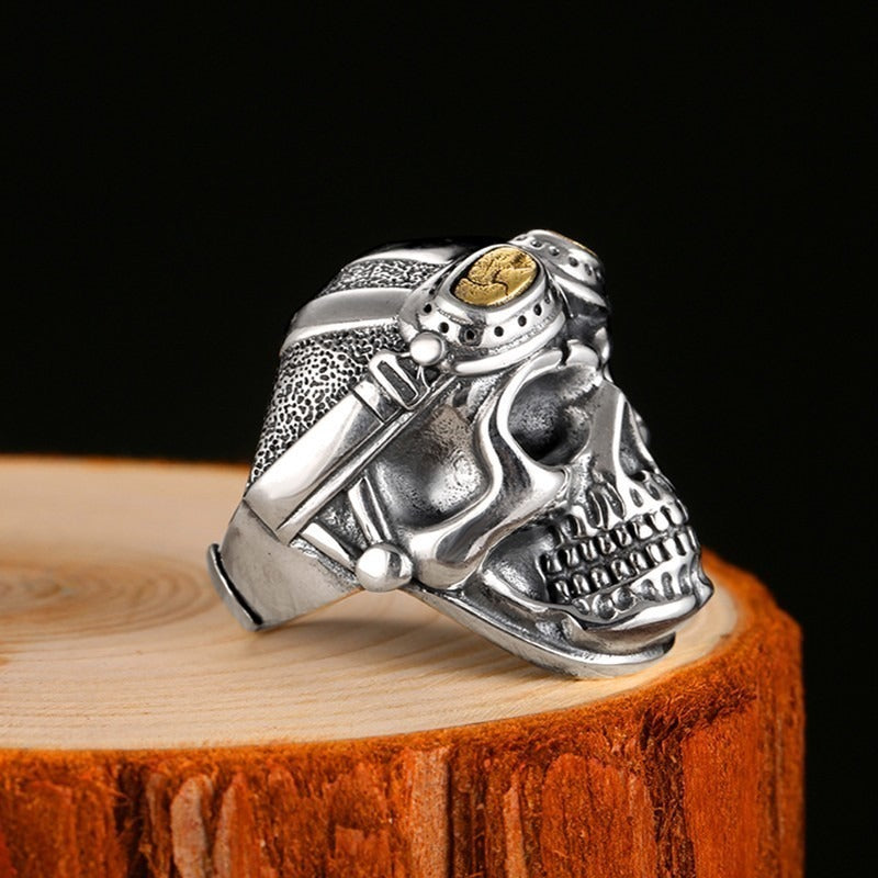 925 Silver Aviator Skull Ring on wooden surface, vintage biker adjustable ring for men and women.