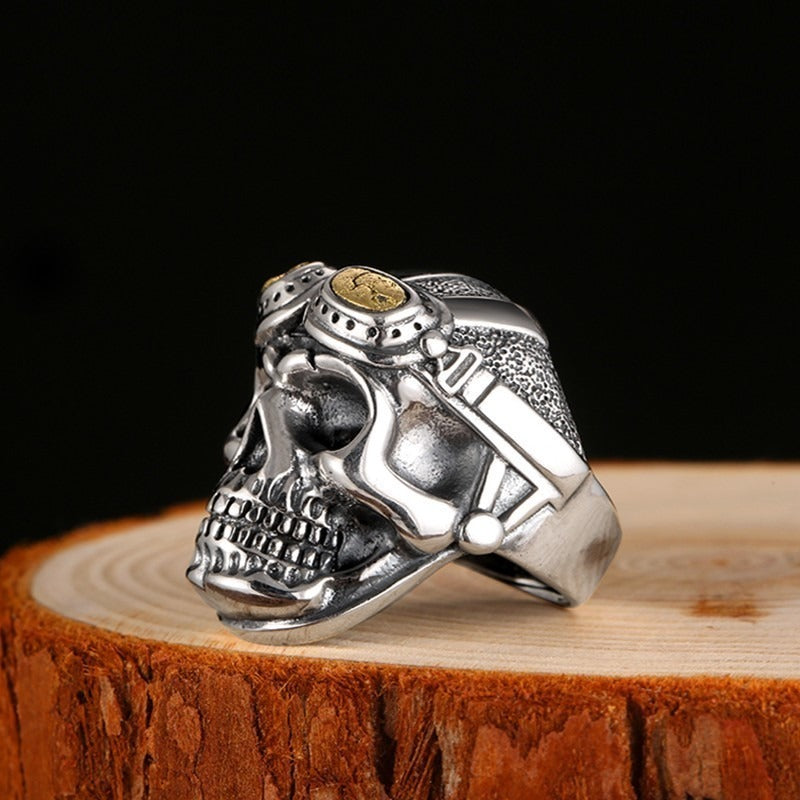 925 silver aviator skull ring on wooden surface, vintage biker fashion accessory for men and women.