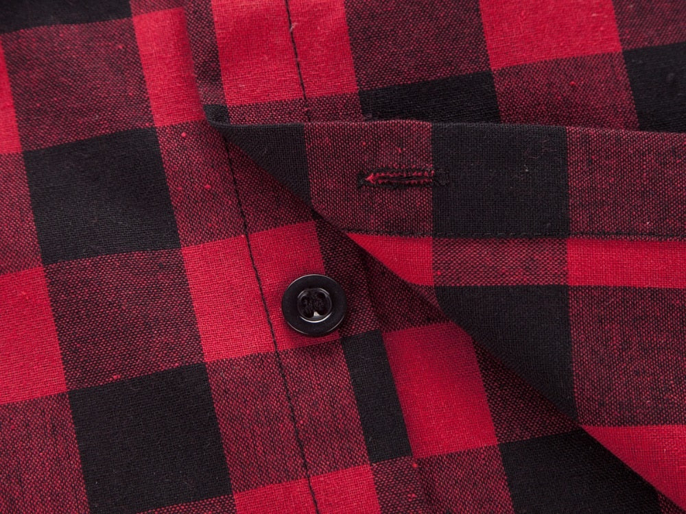 Close-up of a red and black plaid shirt showing button and checkered pattern, perfect for a casual rocker look.