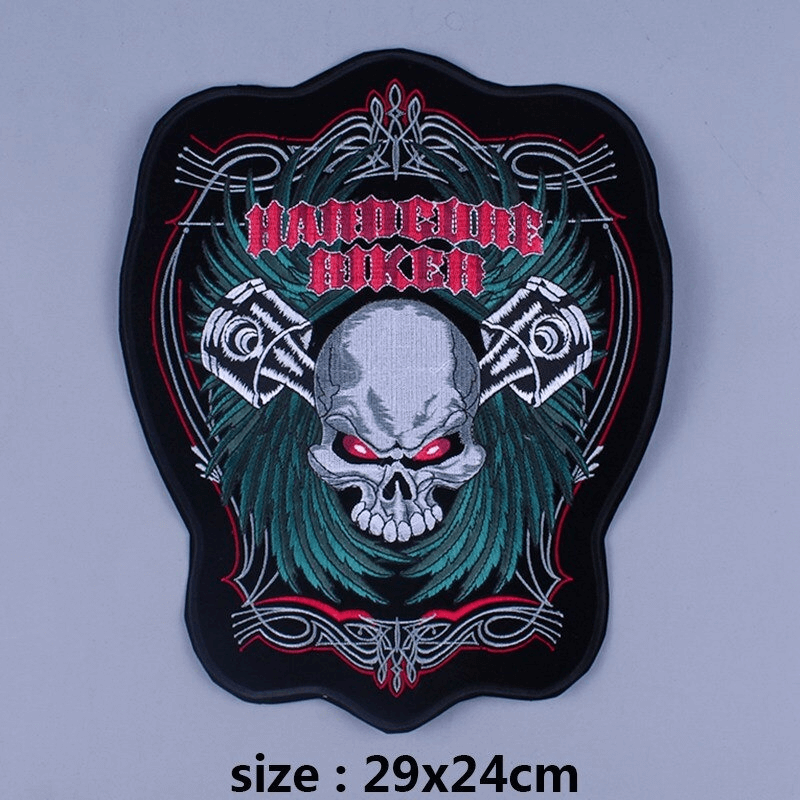 Large red-eyed skull patch with green accents, iron-on design for jackets or bags, perfect for biker style fashion.