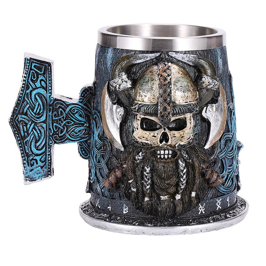 Vintage Viking beer mug with skull and axe design, made of resin and stainless steel, perfect for collectors or as a decorative piece.