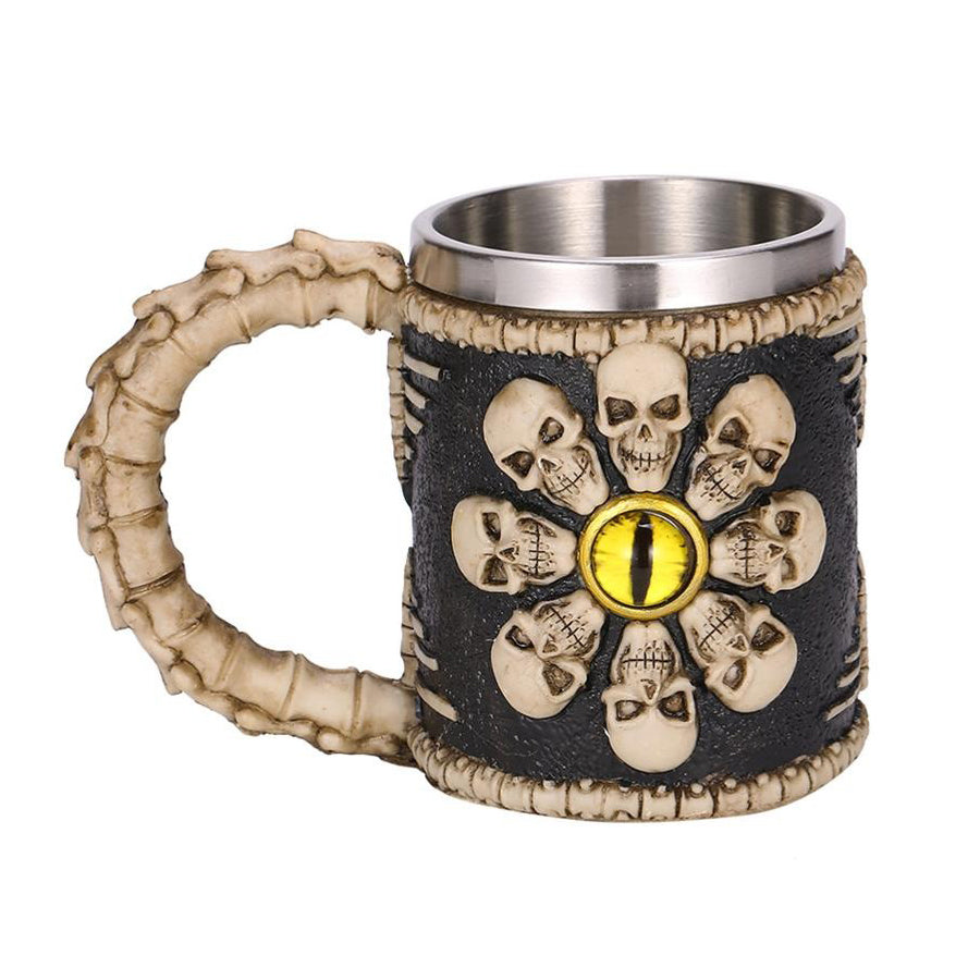 Vintage resin and stainless steel beer mug with skulls and demon eye design, perfect for creative bar enthusiasts.