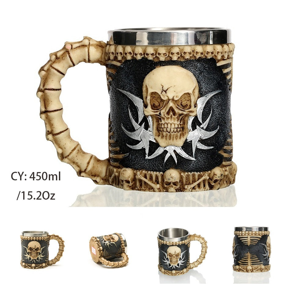 Vintage resin and stainless steel beer mug with skull design and bone handle, perfect for pubs and collectors.
