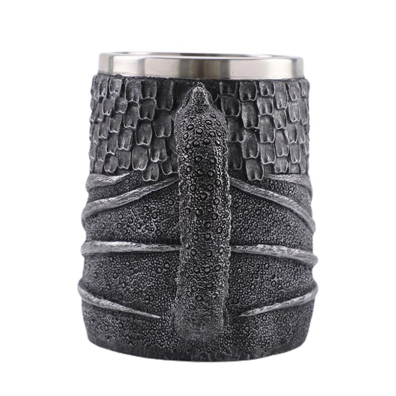 Vintage resin and stainless steel beer mug with dragon design, perfect for Viking-themed parties.
