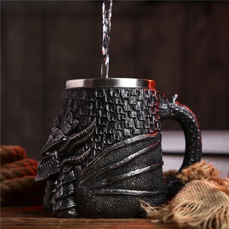 Vintage resin and stainless steel beer mug with dragon design, perfect for retro Viking-themed bars.