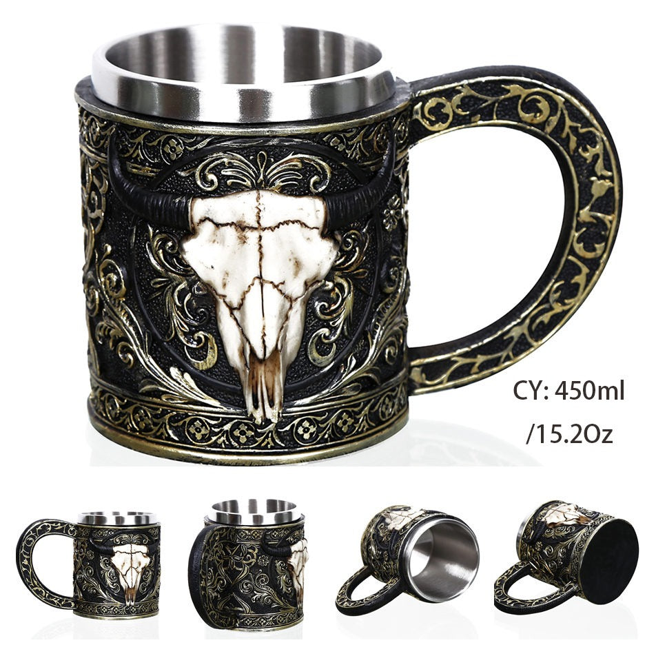 Vintage resin and stainless steel beer mug featuring ox head design, 450ml capacity with intricate black and gold patterns.