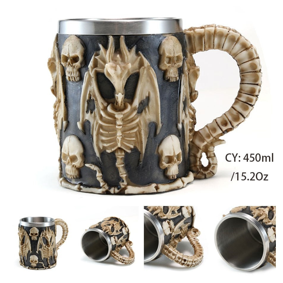 Gothic resin and stainless steel beer mug with skulls and a dragon skeleton, perfect for punk-style fans.