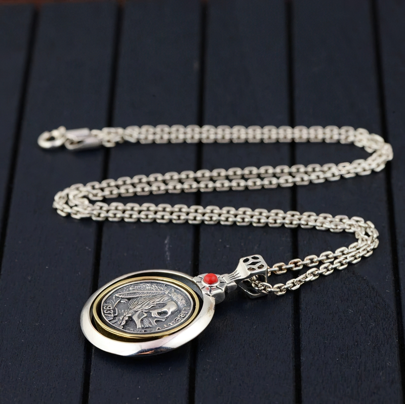 Retro double-sided skull head pendant on a silver chain, perfect gothic accessory for men and unisex rock style.