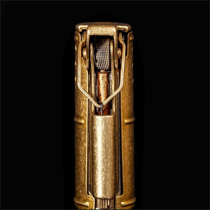 Close-up of a vintage pure copper flint lighter showcasing its intricate mechanism and retro design.