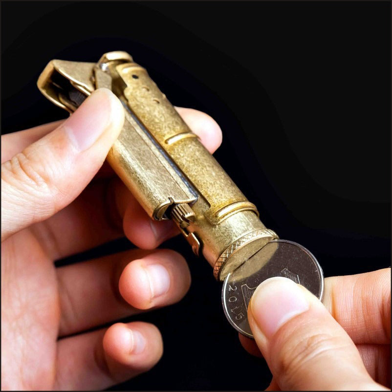 Person holding a retro gasoline flint lighter next to a coin, showcasing its vintage style and practical design.