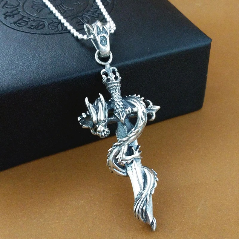 Retro punk silver pendant shaped like a sword with a dragon, perfect for unisex fashion jewelry.