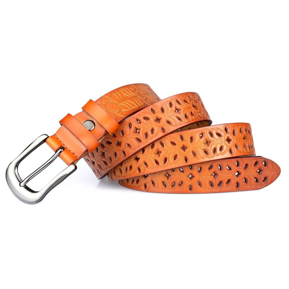 Genuine leather women's belt featuring hollow flower carvings and a stylish pin buckle in vibrant orange.