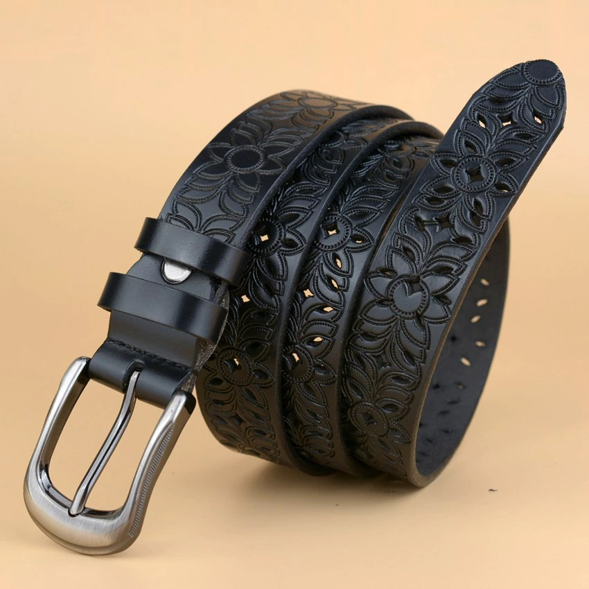 Genuine leather women's belt with hollow flower carvings and rock style pin buckle for alternative fashion.