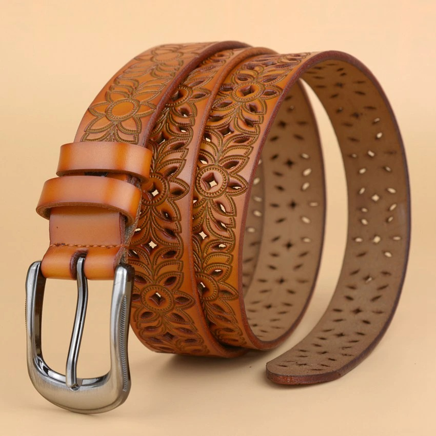 Genuine leather women's belt featuring hollow flower carvings and a stylish pin buckle, perfect for alternative fashion.
