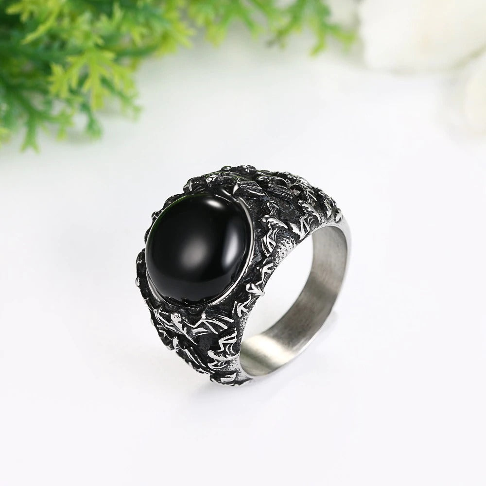 Gothic black stainless steel ring featuring a bold black onyx stone, perfect for vintage-inspired outfits.