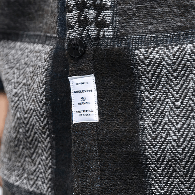Close-up of a retro woolen plaid shirt with fashion buttons and care label, highlighting its casual style for men.