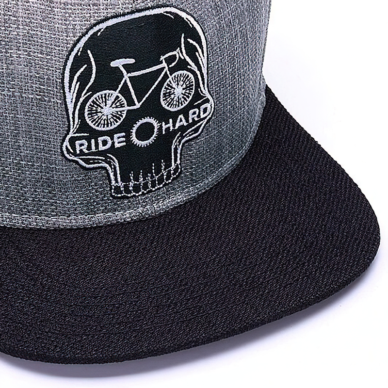 Ride Hard Skull Baseball Cap with bicycle design and embroidery for a cool biker style look.
