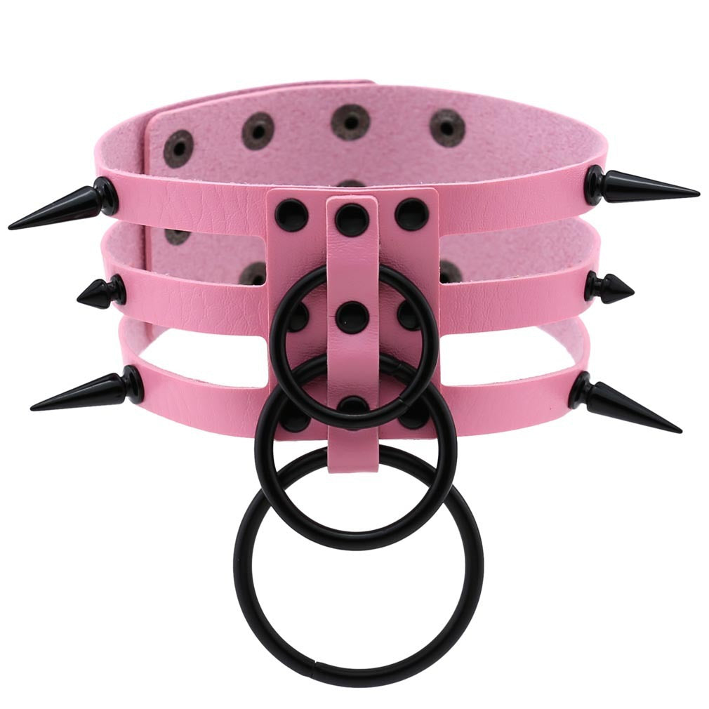 Rivet leather spiked choker in pink with black metal rings, perfect for punk rock fashion and alternative styles.