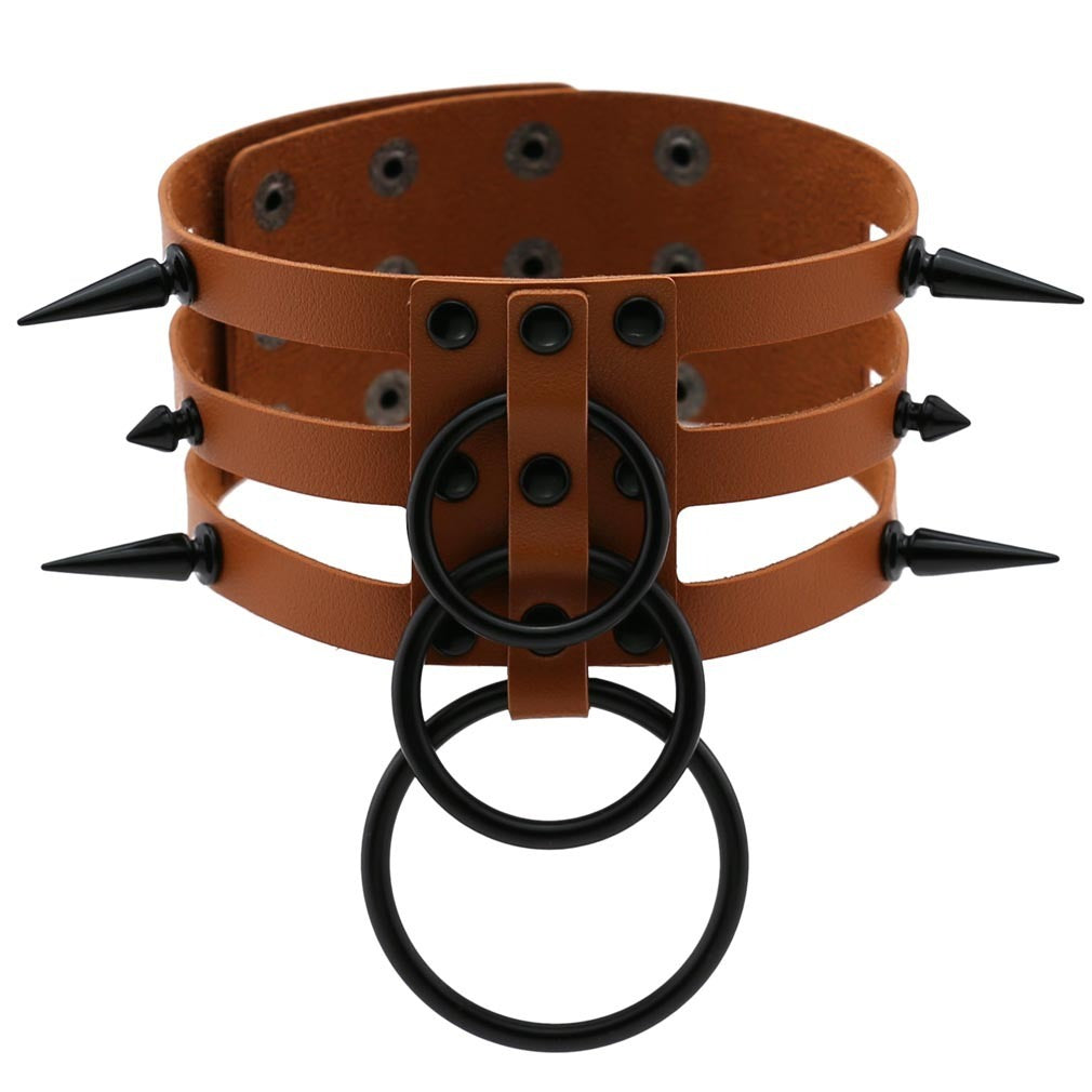 Rivet leather spiked choker with metal rings, perfect for alternative fashion and punk rock outfits.
