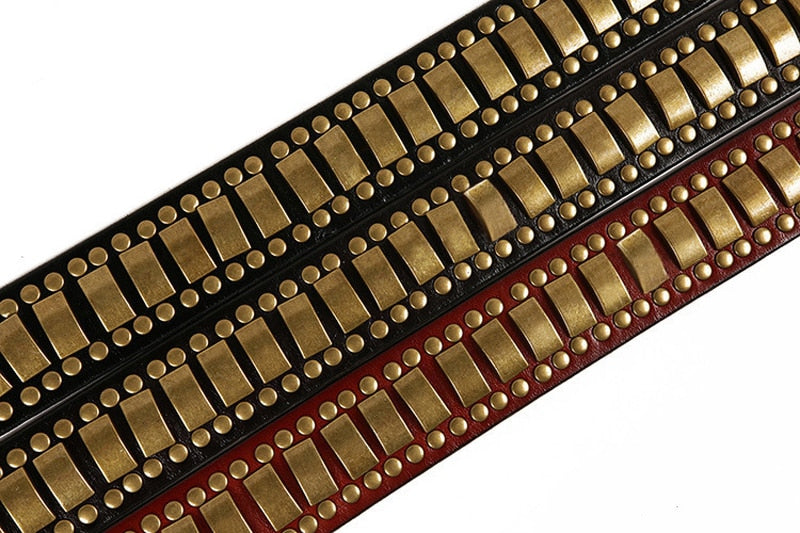 Rock belts featuring a geometry pattern with decorative rivets in black and red leather, perfect for stylish outfits.