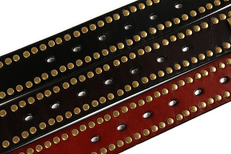 Rock belts in black and red with riveted decorative studs, perfect for alternative fashion styles.