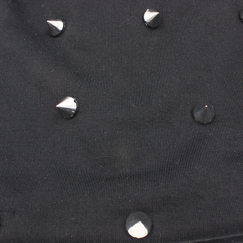 Close-up of a black cotton hat with silver spikes, showcasing a rock & metal style. Perfect for alternative fashion lovers.