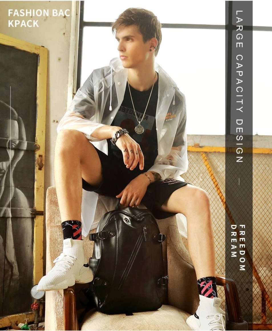 Fashionable young man with large capacity black backpack, showcasing a trendy look in urban style.