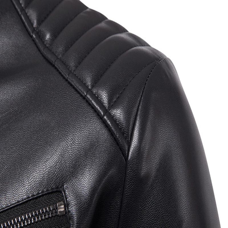 Close-up of the shoulder detail on a rock style faux leather biker jacket with quilted texture.