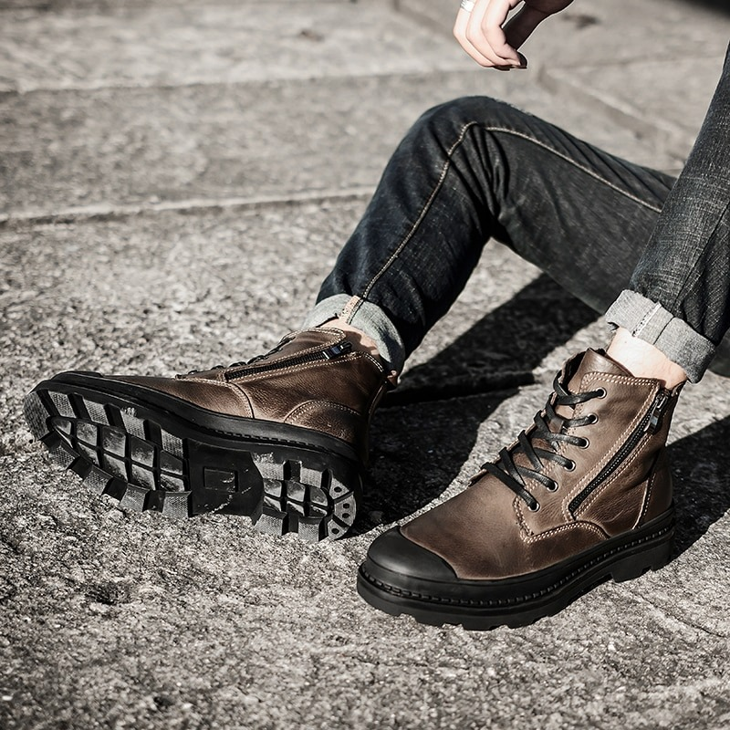 Stylish men's leather ankle boots in brown, featuring laces and a rugged sole, perfect for casual rock style fashion.