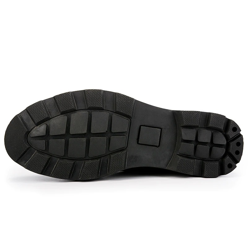 Sole view of men's leather ankle boots showcasing durable tread and grip, perfect for casual wear in stylish rock fashion.