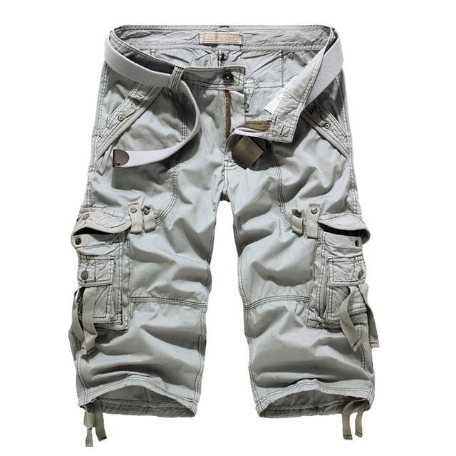 Rock style loose camouflage cargo shorts for men with pockets and zippers, ideal for a trendy military look.