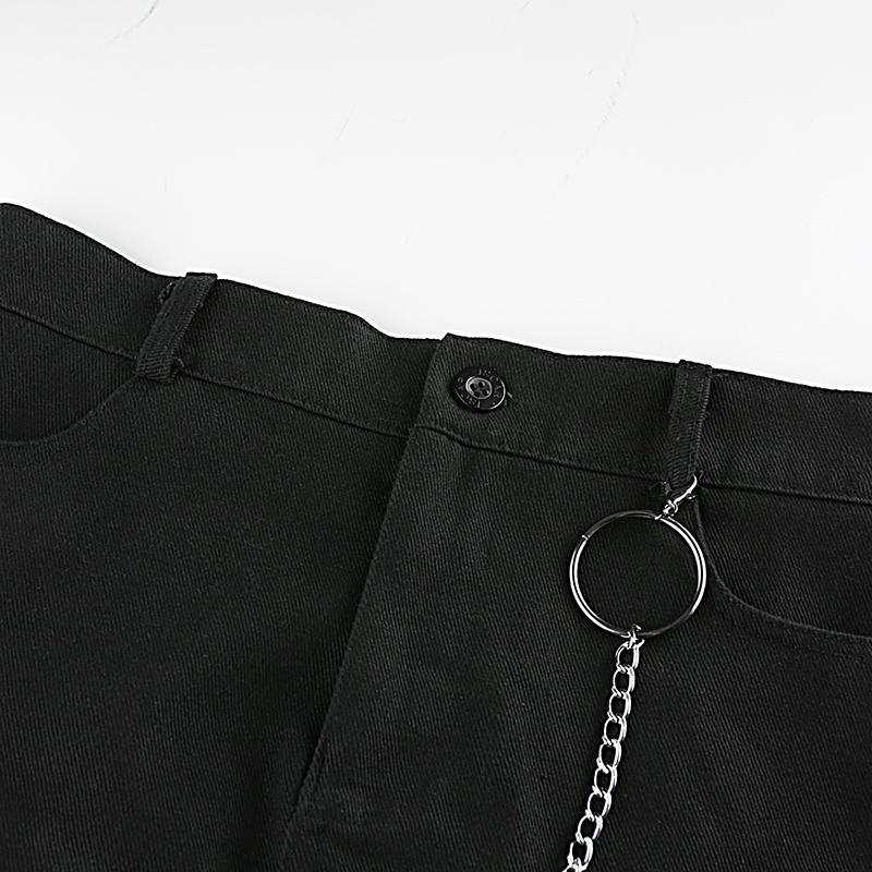 Black high waist mini skirt featuring a stylish ring chain and button detail, perfect for an edgy casual look.