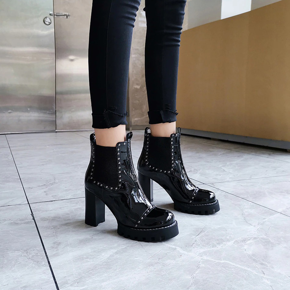 Rock style genuine leather ankle boots with rivets and high heels, perfect for edgy fashion enthusiasts.