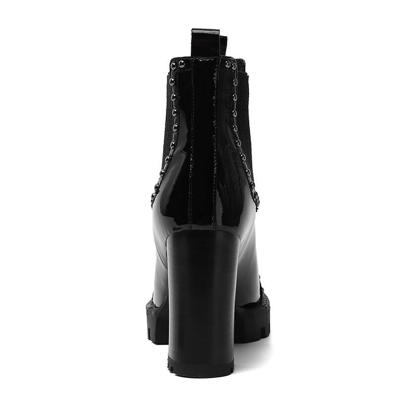 Back view of rock style genuine leather ankle boots with high heels and rivet detailing.