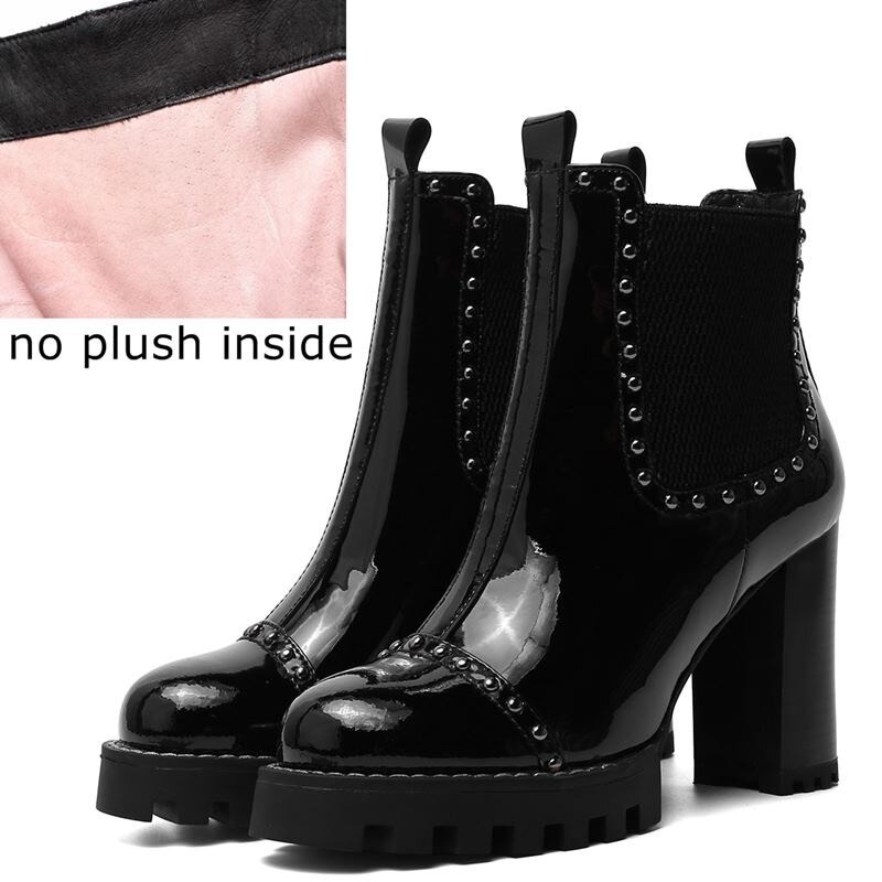 Rock style black leather ankle boots with round toe, rivets, and high platform heels, no plush lining inside.