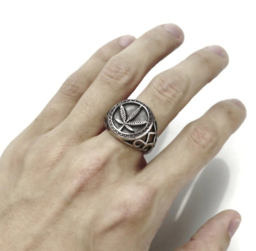 Men's vintage stainless steel ring featuring a detailed hemp leaf design, perfect for biker style outfits.