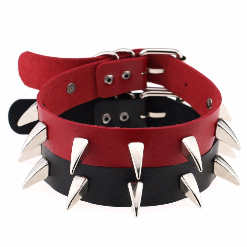Rock style leather choker necklace with red and black spikes, adjustable and perfect for gothic or biker looks.